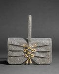 Rhinestone-embellished wristlet with a wrist strap